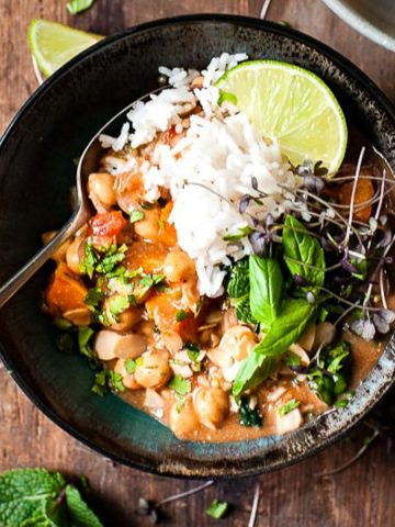 Chickpea curry with rice and basil.