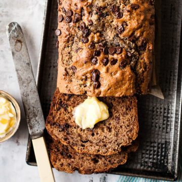 Chocolate chip banana bread with butter.