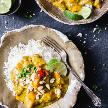 Creamy pumpkin curry with rice and limes.