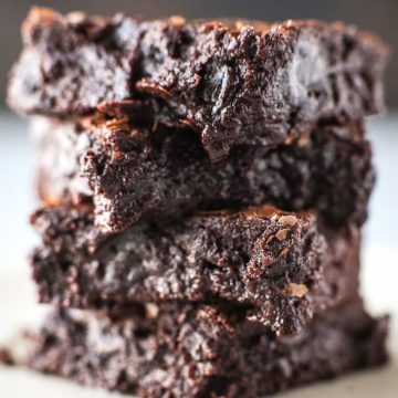 A stack of chewy brownies on a table.