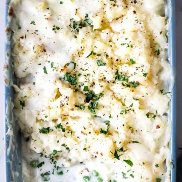 Mashed potato topped fish pie with parsley.