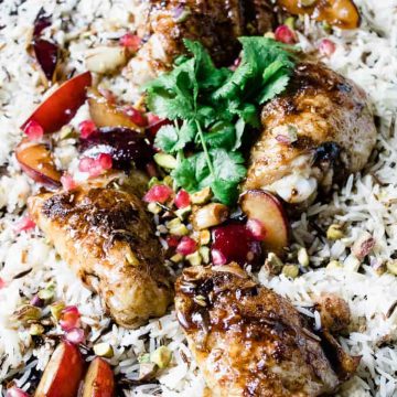 Roasted chicken with pomegranate sauce and rice.