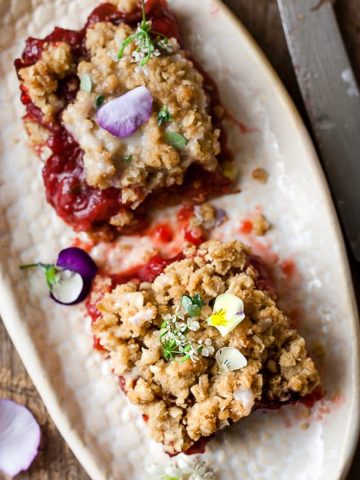 Strawberry oat bars on a white plate.