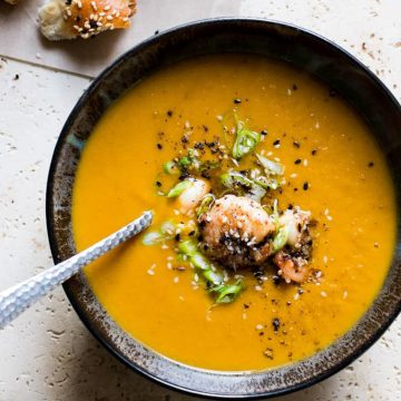 Sweet potato soup with shrimp and green onions.