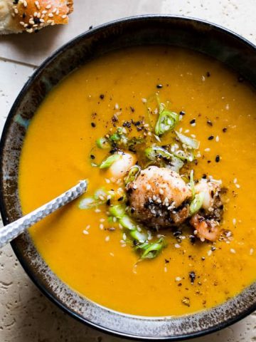 Sweet potato soup with shrimp and green onions.