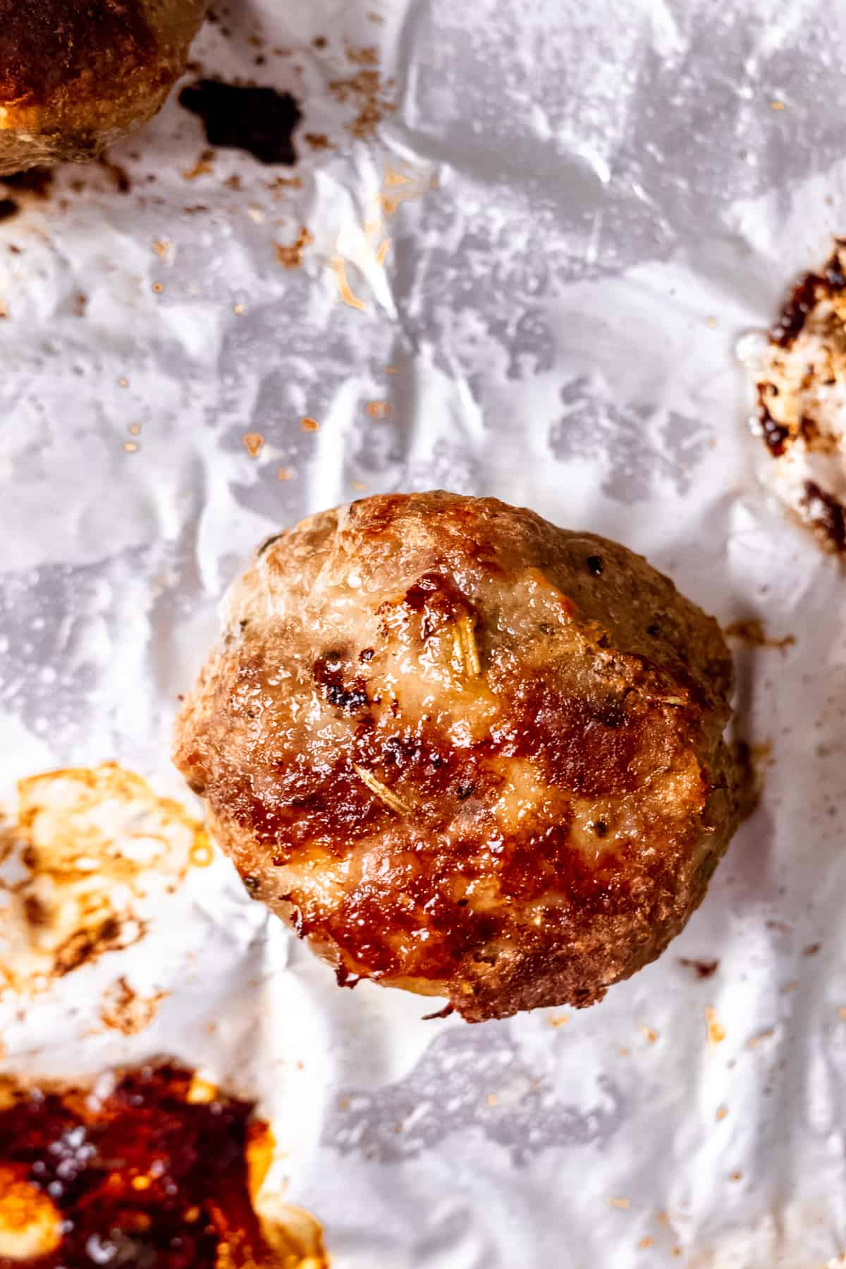 Baked lamb meatballs on a tray.