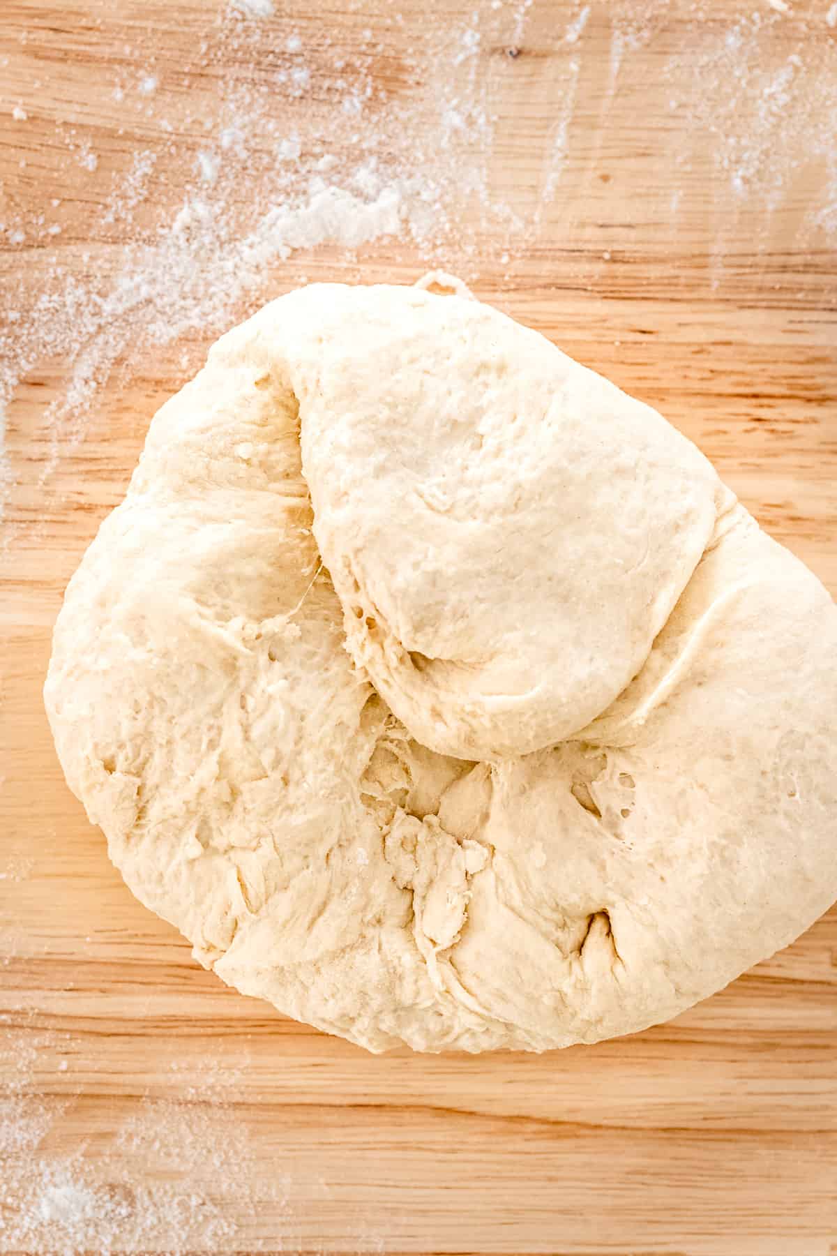 Kneading pizza dough.