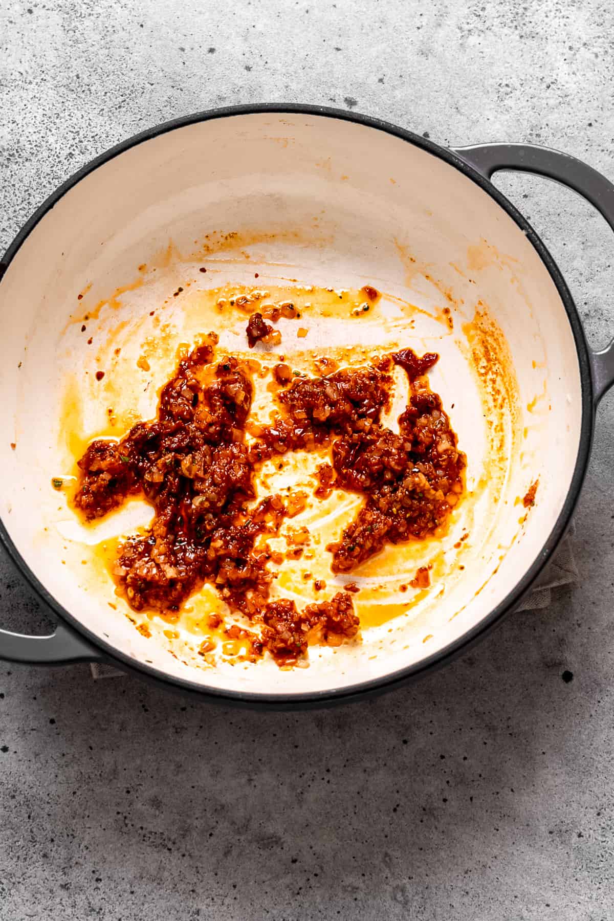 Tomato paste added to meatball sauce.