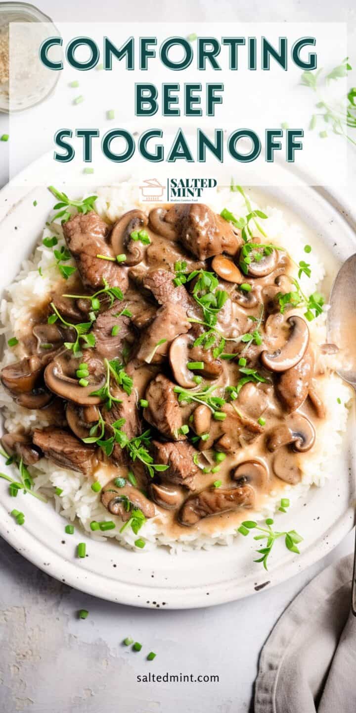 Rich beef stroganoff on a white plate with text overlay.