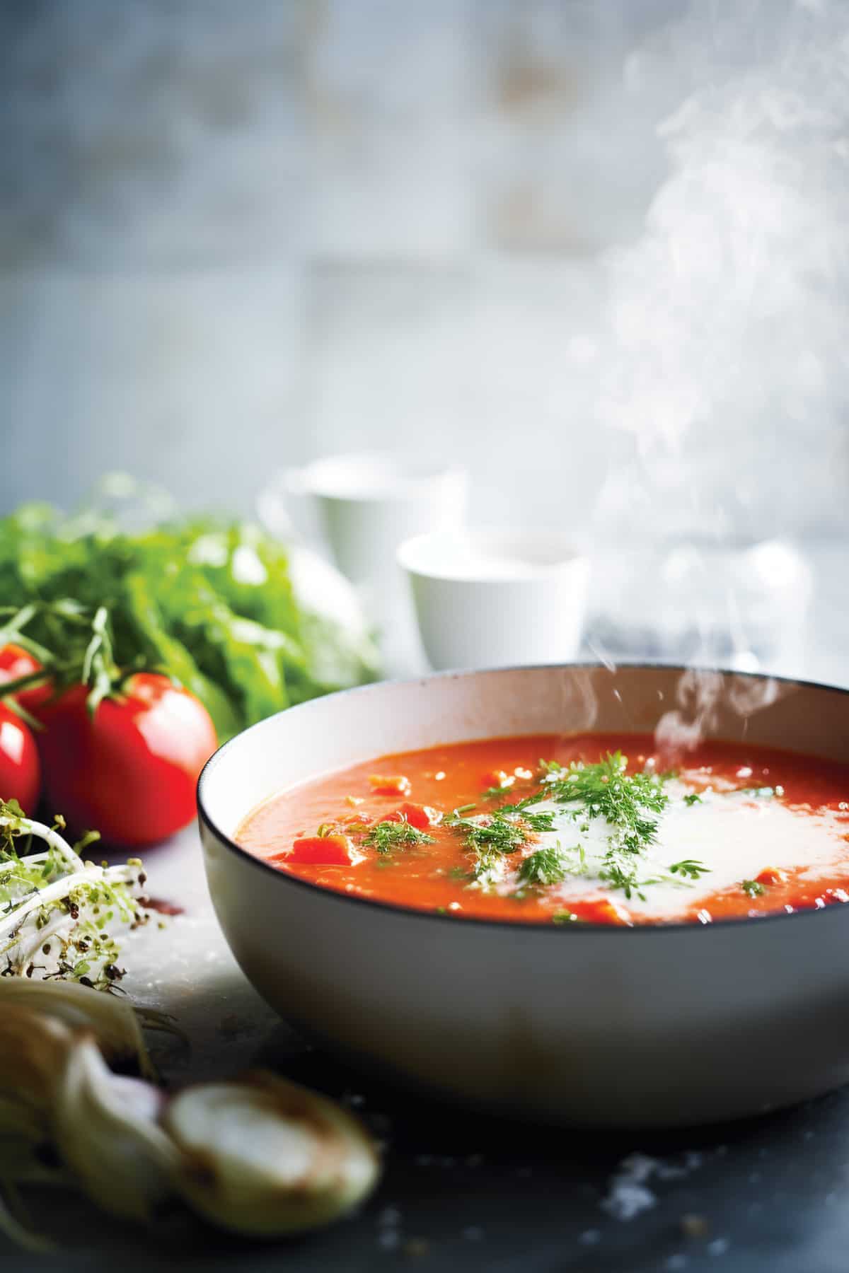 Roasted tomato soup simmering in a pot.