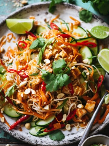 Vegetable pad thai on a white plate.