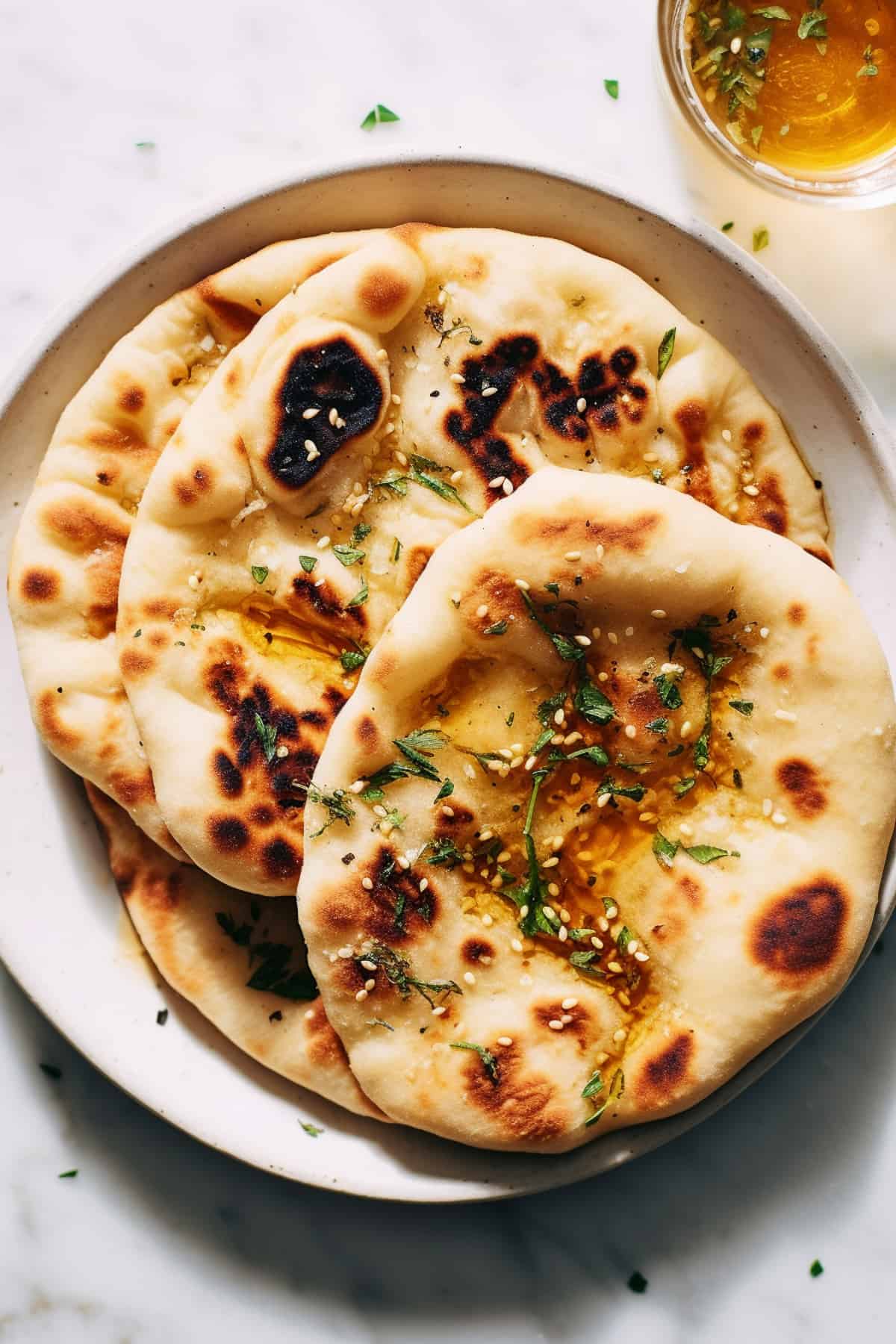 2 Ingredient naan bread on a white plate.