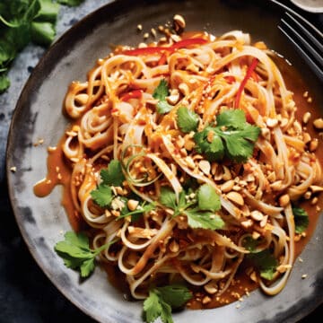 Thai peanut noodles with peanut sauce in a bowl.