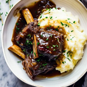 Slow cooker braised short ribs with mashed potatoes.