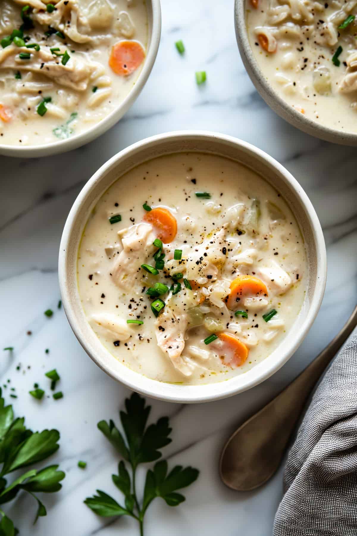 Creamy chicken and rice soup with vegetables.