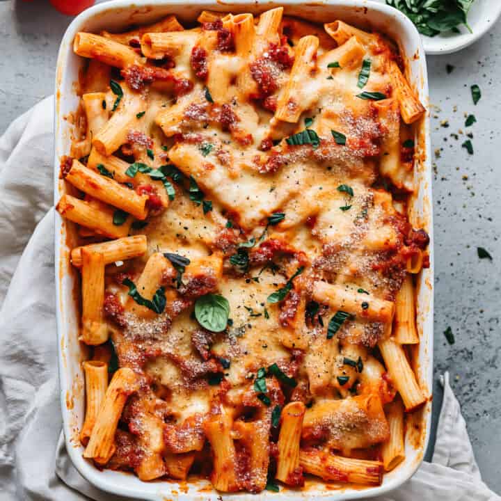 Easy chorizo pasta bake with basil in a baking dish.