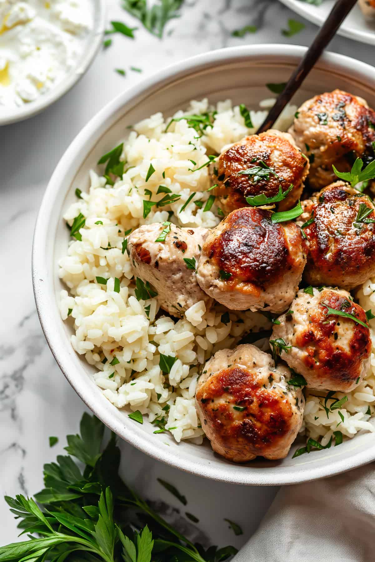 Greek chicken meatballs with feta and rice.
