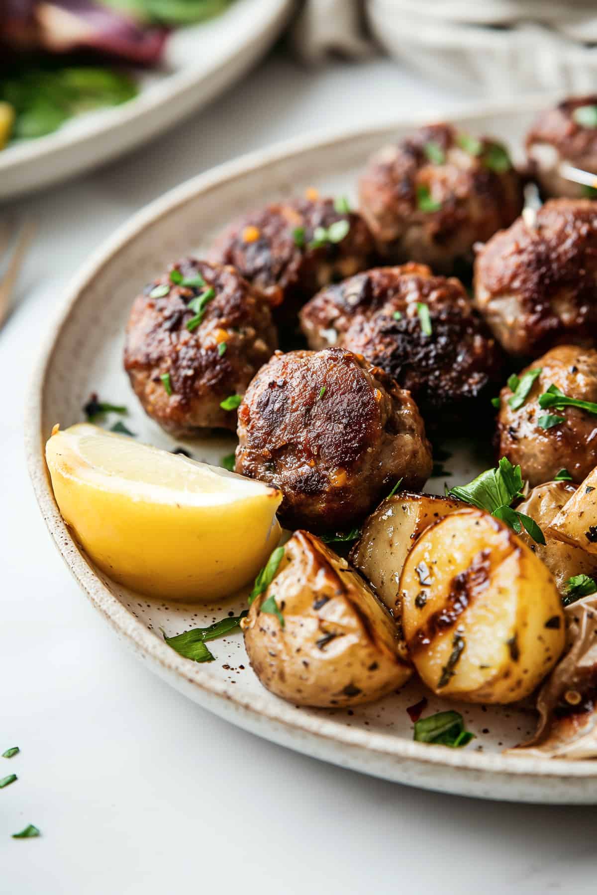 Traditional Greek meatballs-Keftedes with roast potatoes.