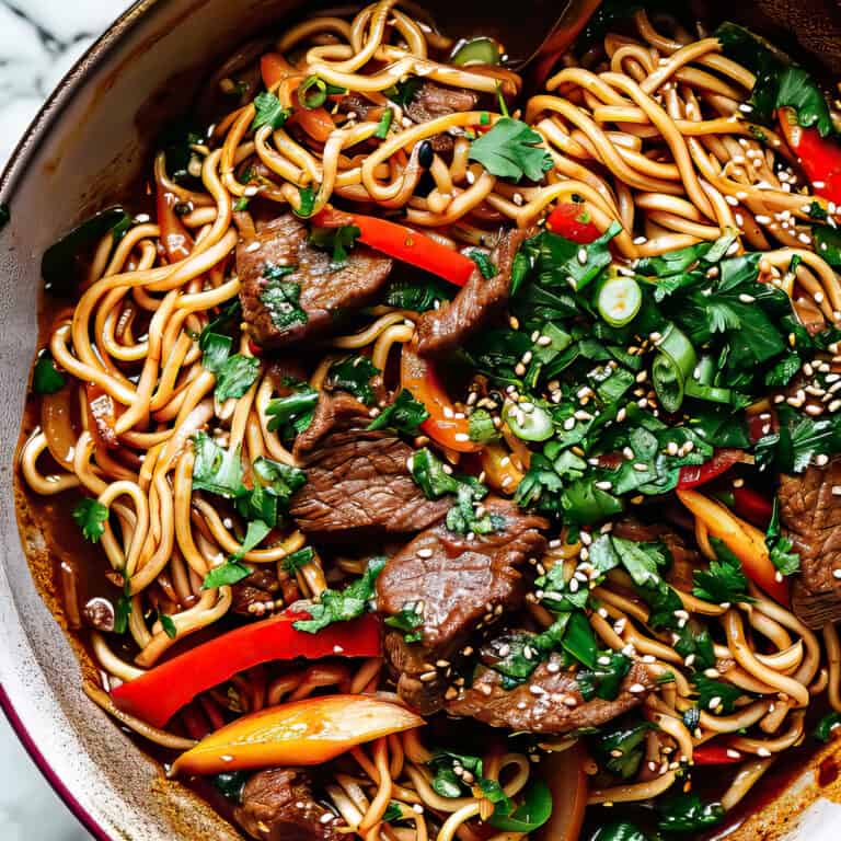 Korean stir-fried noodles with beef and vegetables.