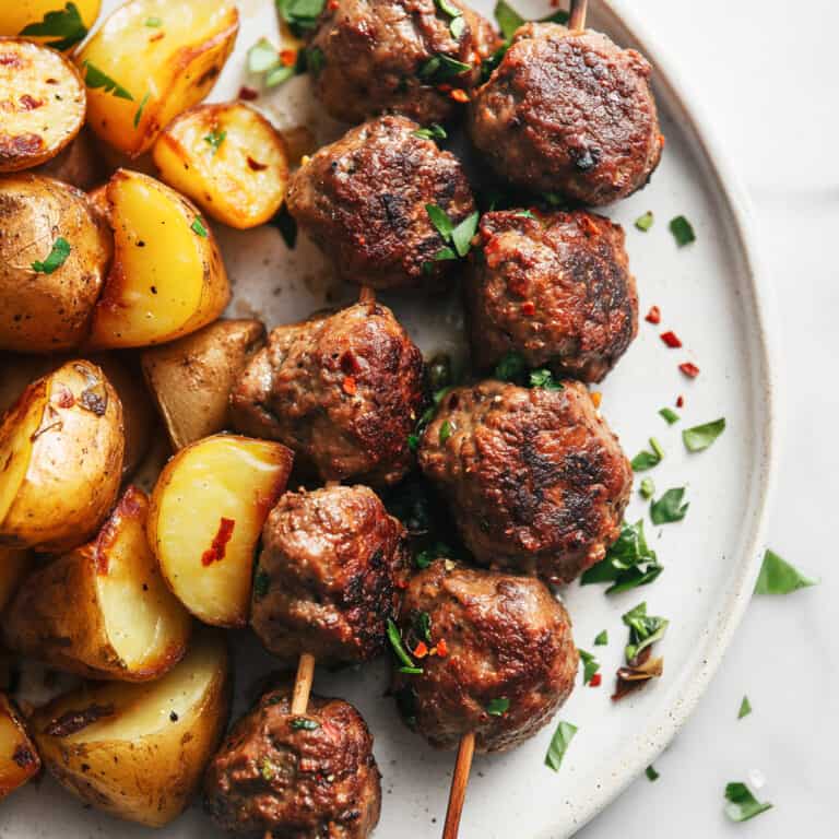 Traditional Greek meatballs-Keftedes with roast potatoes.