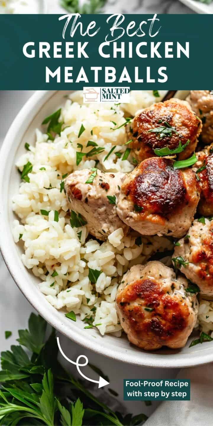 Greek chicken meatballs with rice and herbs in a white bowl.