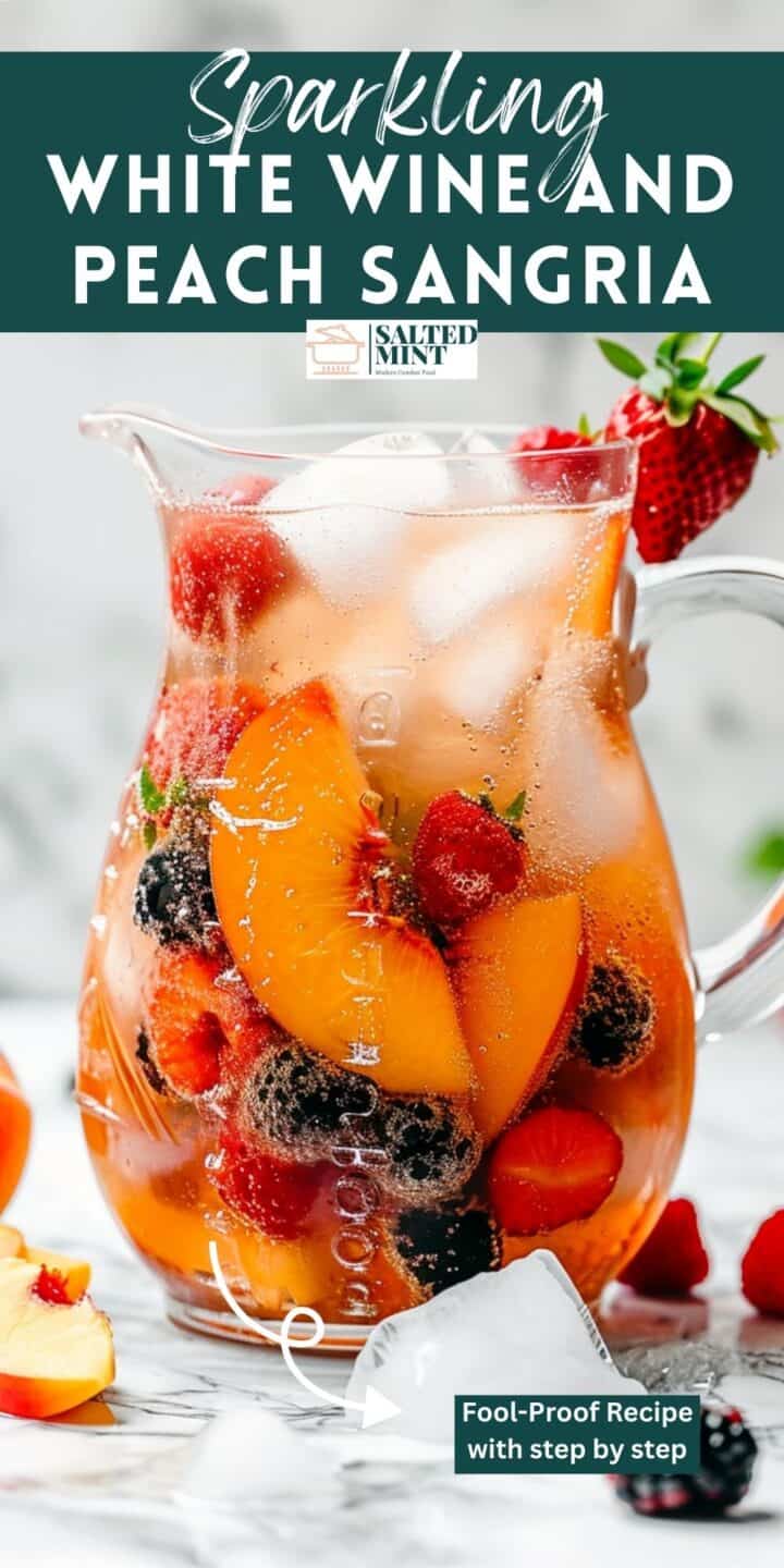Peach sangria with berries and sparkling wine.