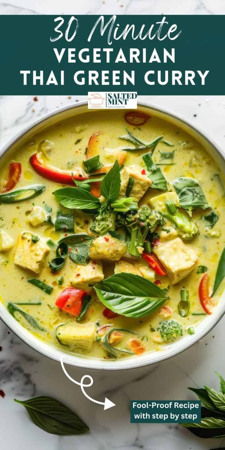 Vegetarian Thai green curry with tofu in a white bowl with basil.
