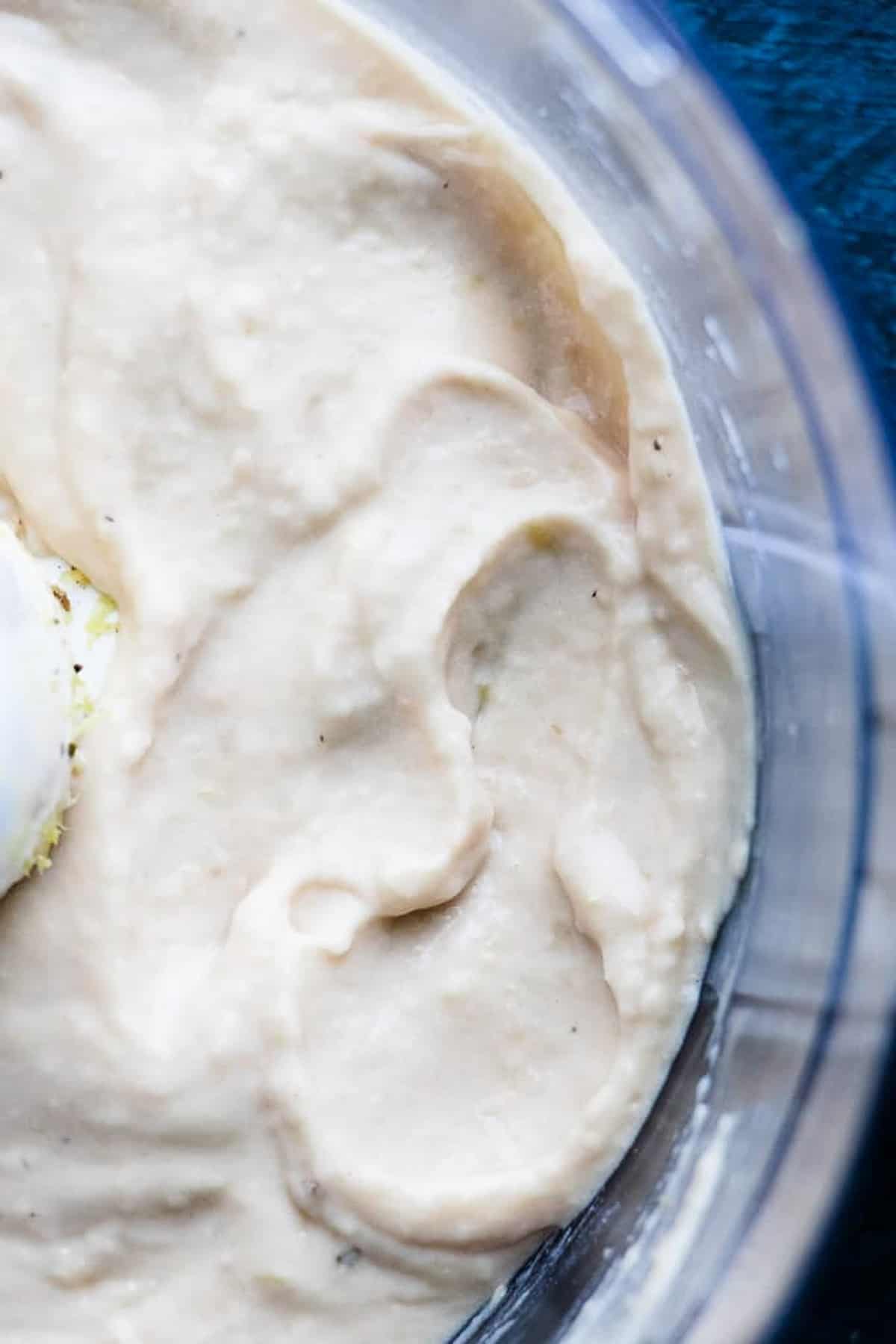 White bean dip blended until smooth and creamy in a food processor.