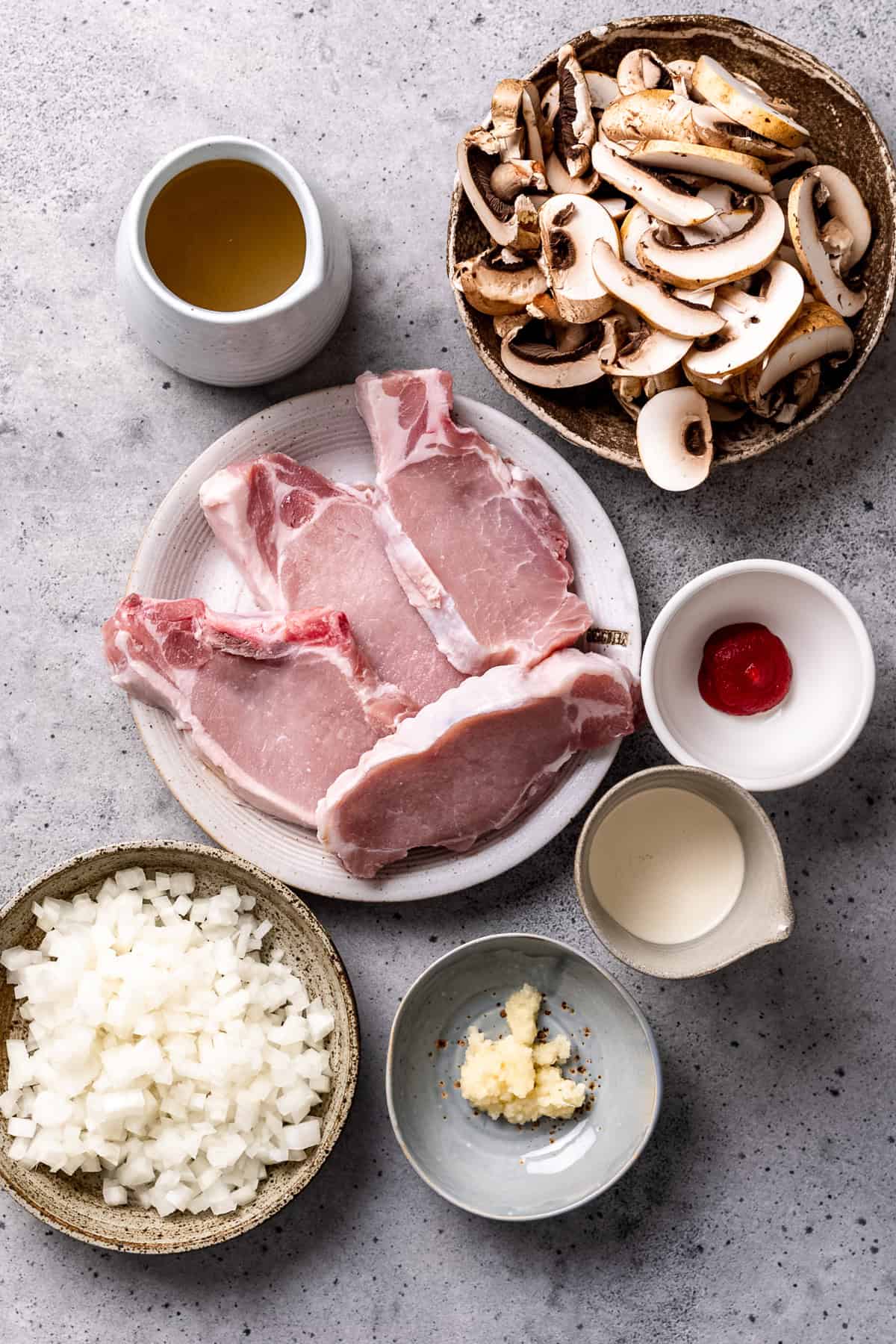 Ingredients for crock Pot pork chops with mushroom sauce on a table.