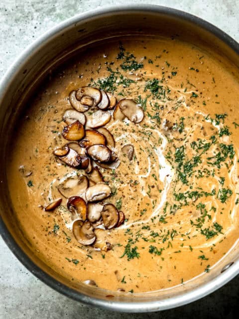 Hungarian mushroom soup with cream and parsley.