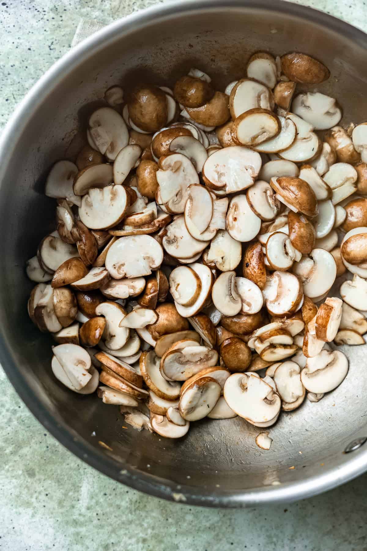 Mushrooms thinly sliced for Hungarian mushroom soup.