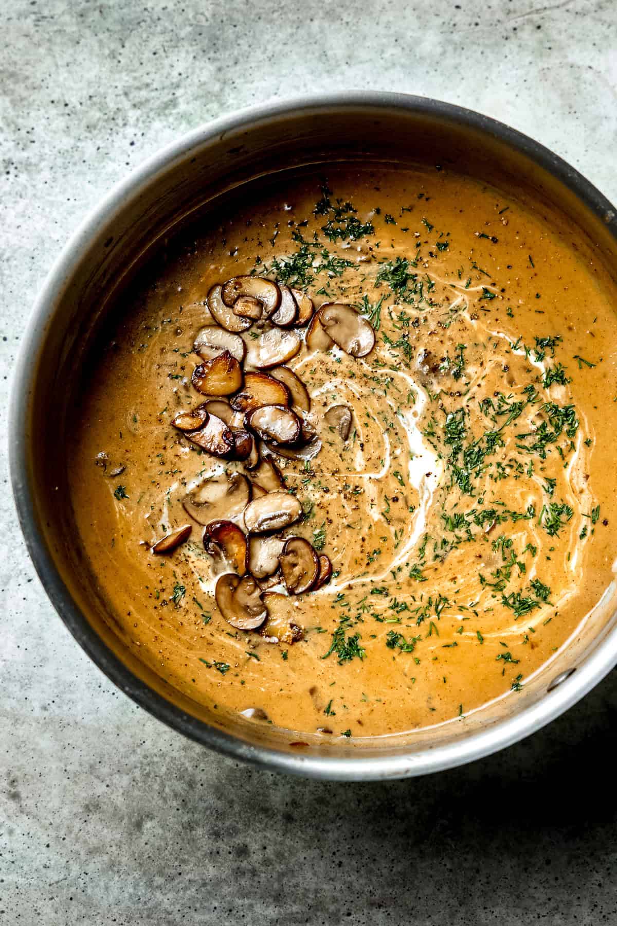 Hungarian mushroom soup with cream and parsley.