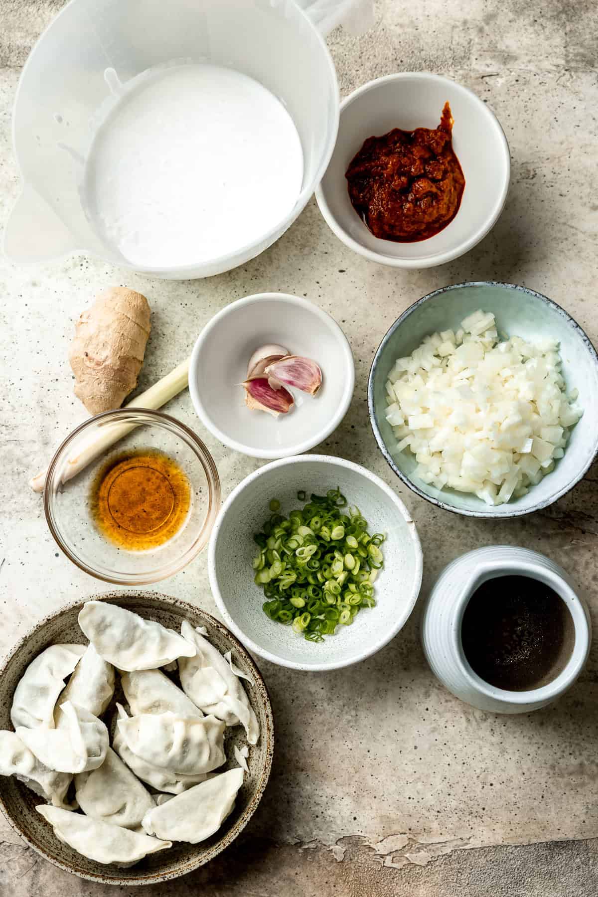 Dumplings and ingredients for Thai dumpling soup.